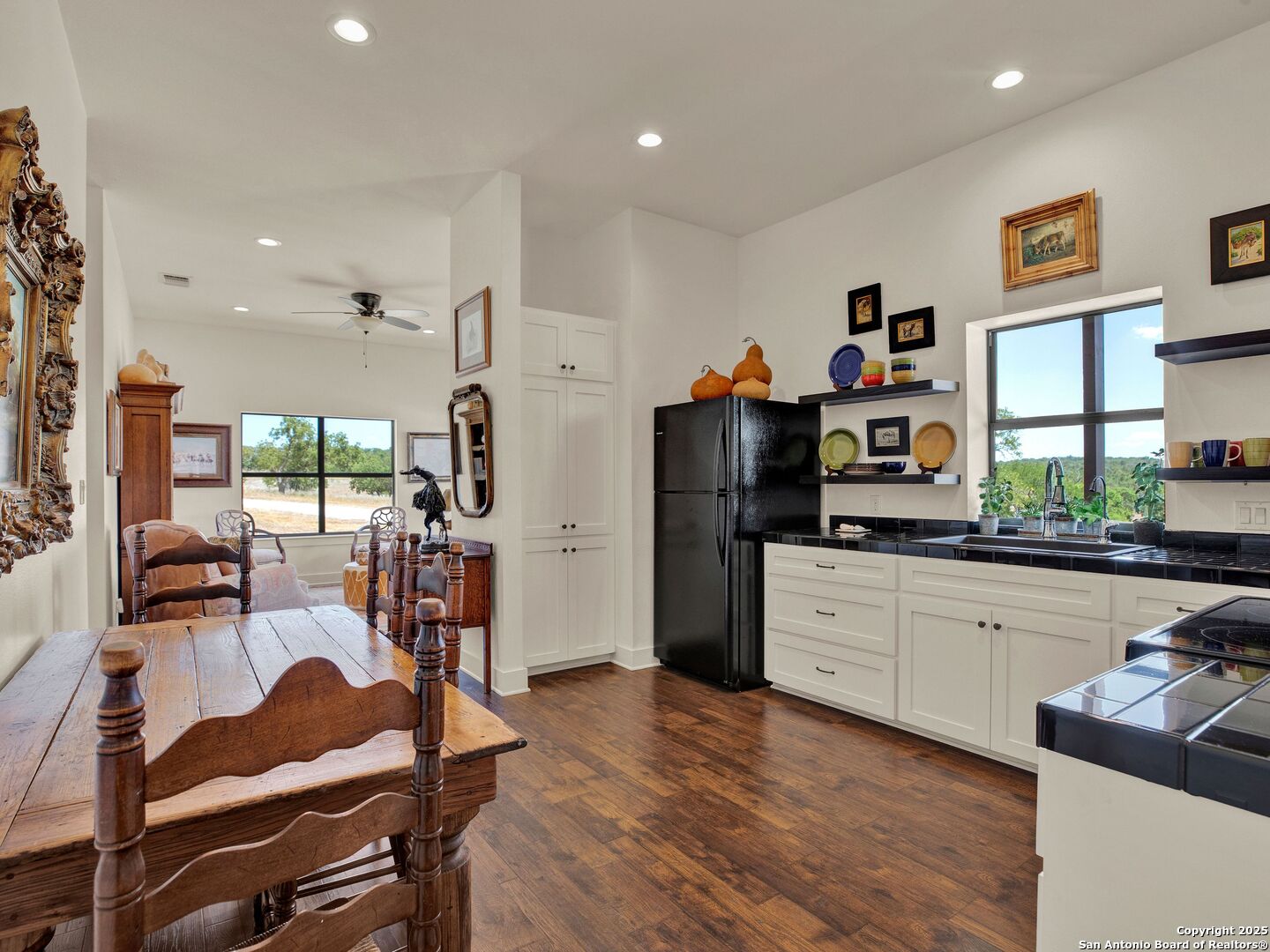 862 Grape Creek Road Fredericksburg, TX 78624 - Photo 87 of 90 a kitchen with stainless steel appliances kitchen island granite countertop a refrigerator and a stove top oven