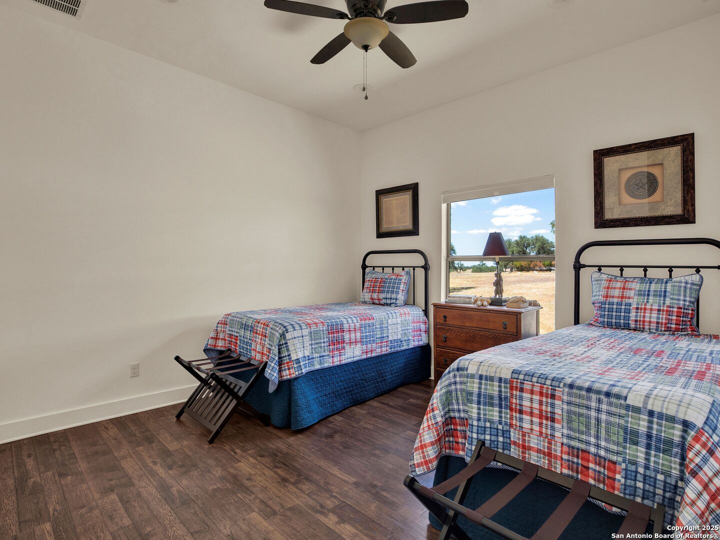 862 Grape Creek Road Fredericksburg, TX 78624 - Photo 89 of 90 a bedroom with two beds and ceiling fan