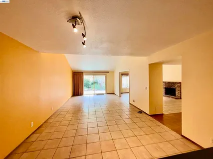 a kitchen with stainless steel appliances a sink a stove a refrigerator and cabinets