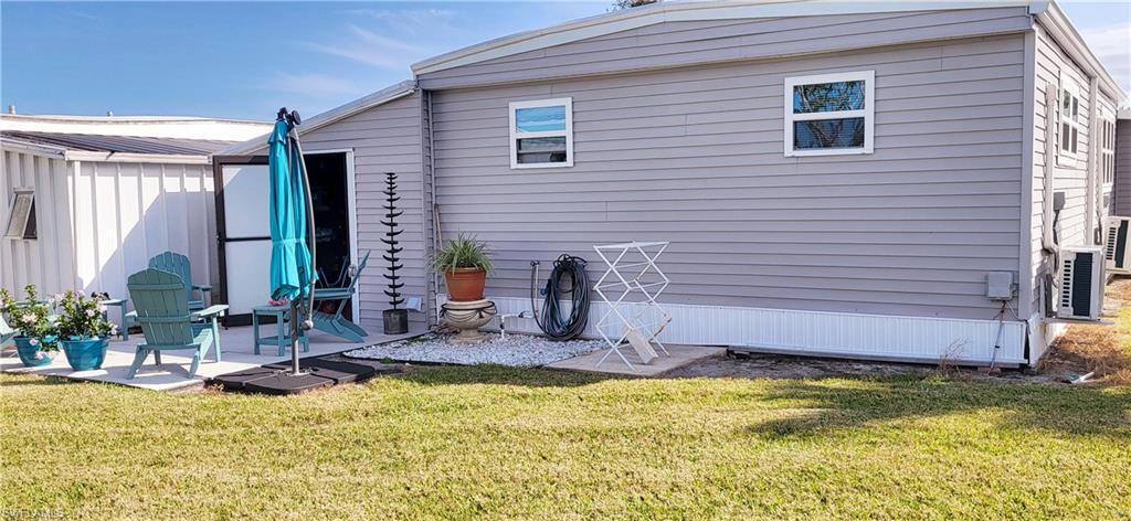 21 Diamond Lane, Unit D21 Naples, FL 34112 - Photo 3 of 5 a view of a house with swimming pool