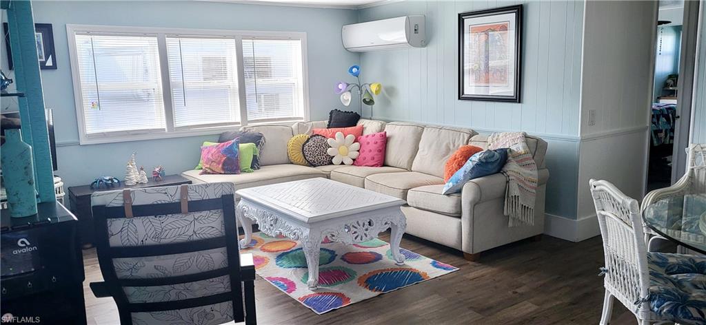 21 Diamond Lane, Unit D21 Naples, FL 34112 - Photo 4 of 5 a living room with furniture and a window