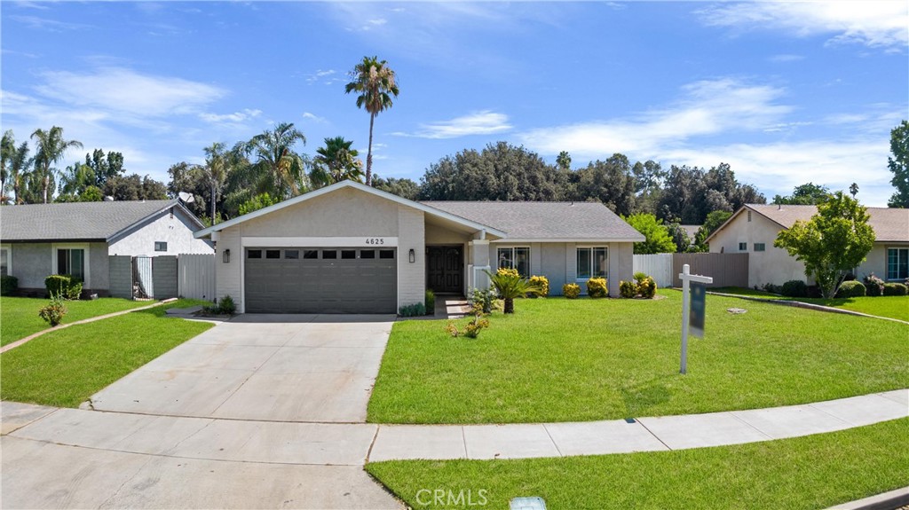 4625 La Paz Lane Riverside, CA 92501 - Photo 1 of 1 a front view of a house with a garden and yard