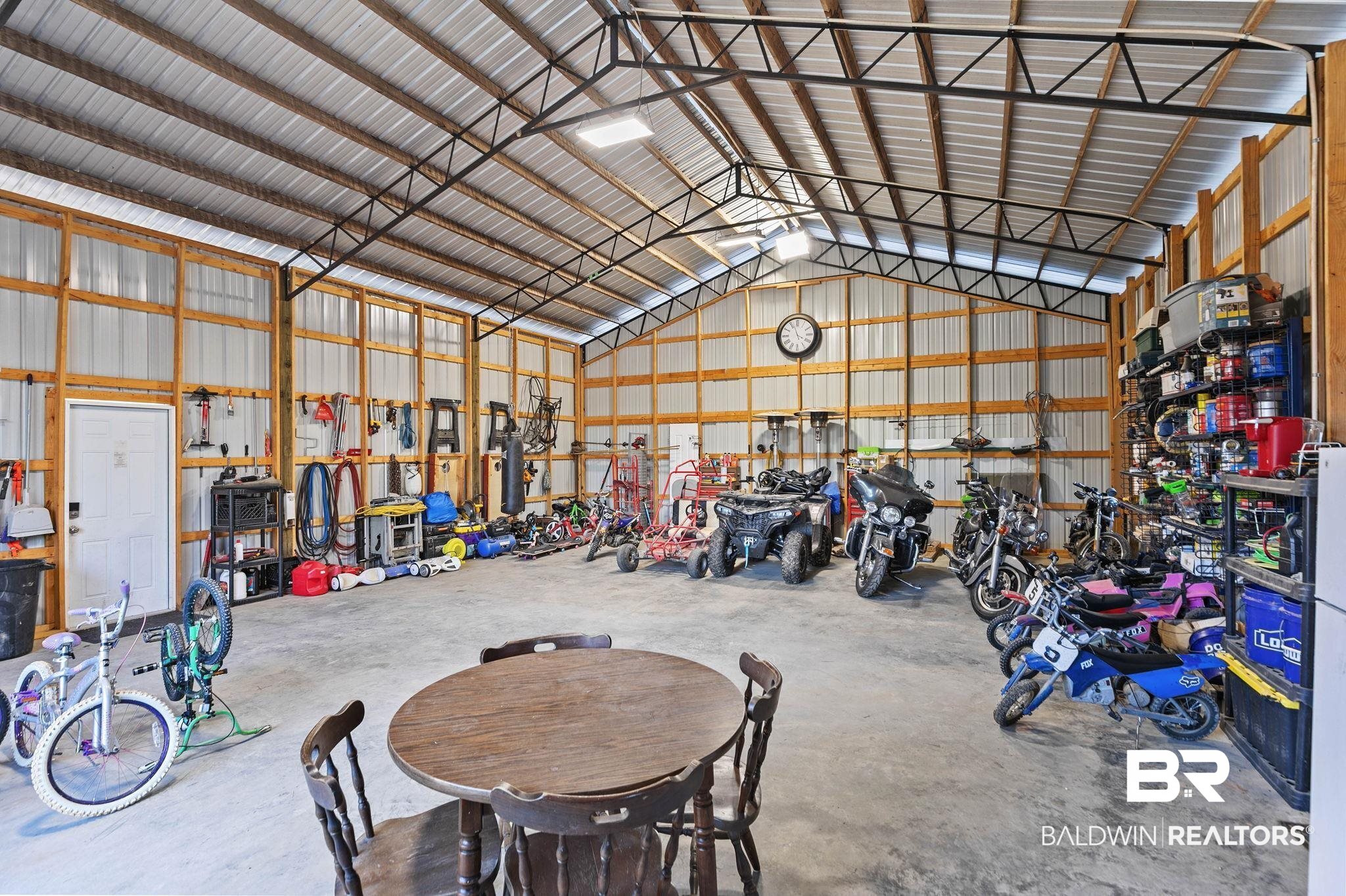55750 Lottie Road Perdido, AL 36562 - Photo 38 of 84 Garage featuring metal wall and a workshop area