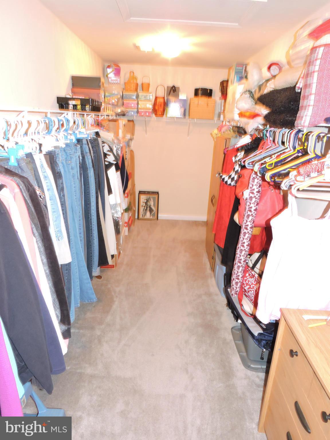 63 Ruland Drive Bunker Hill, WV 25413 - Photo 22 of 28 Master closet (6' x 20') has room for your finery