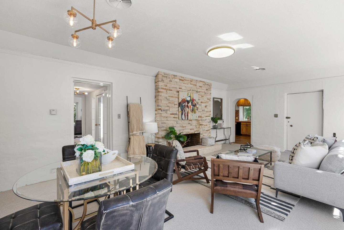 807 Cañada Road Woodside, CA 94062 - Photo 12 of 35 a living room with furniture and a chandelier