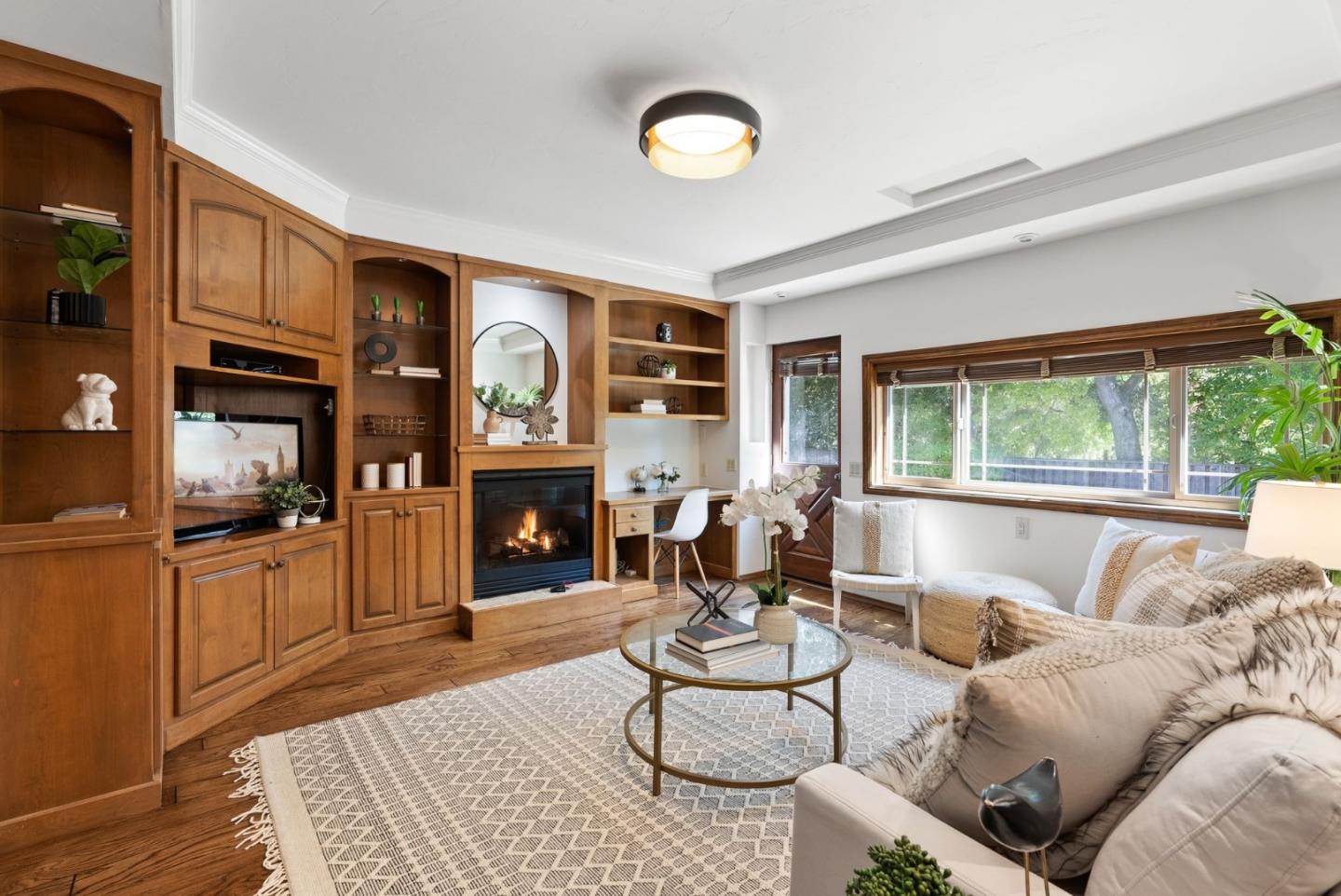 807 Cañada Road Woodside, CA 94062 - Photo 14 of 35 a living room with furniture and a fireplace