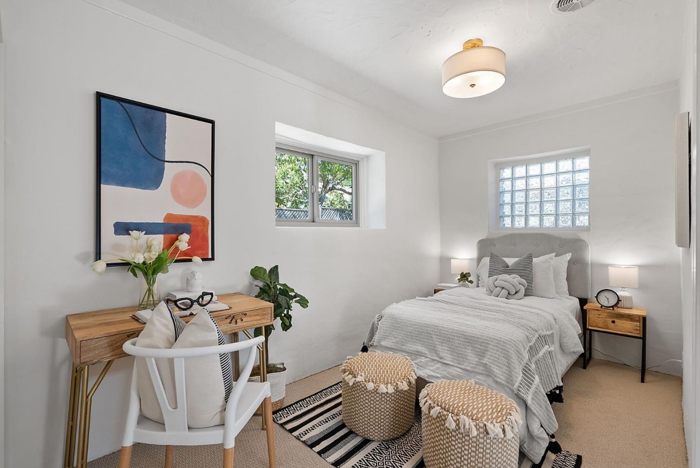 807 Cañada Road Woodside, CA 94062 - Photo 22 of 35 a bedroom with a bed and a chandelier
