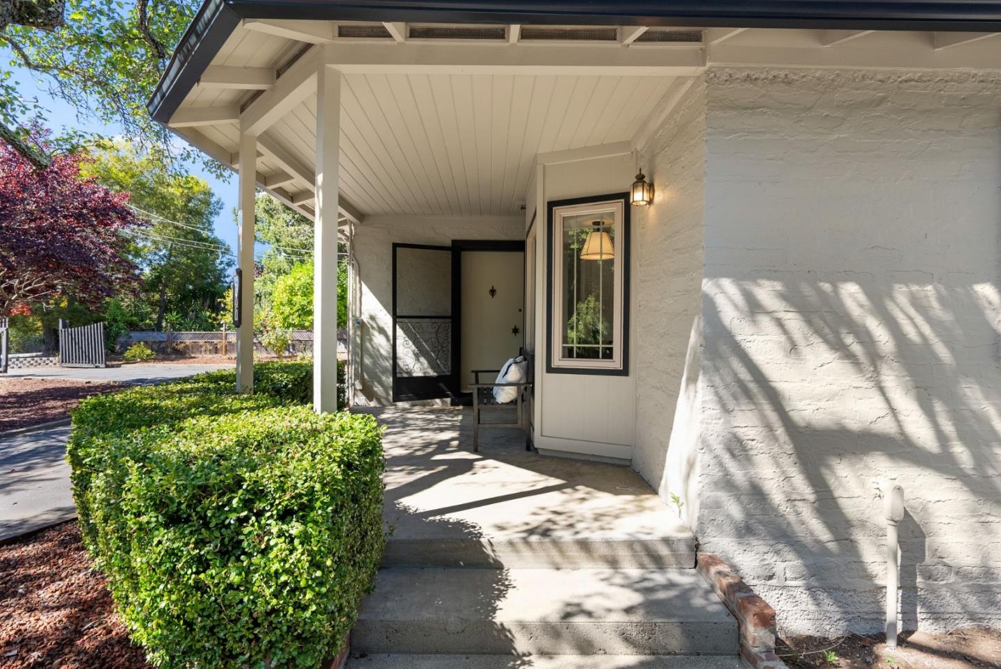 807 Cañada Road Woodside, CA 94062 - Photo 7 of 35 a front view of a house with a porch