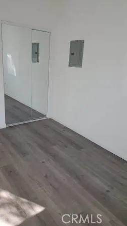 an empty room with wooden floor