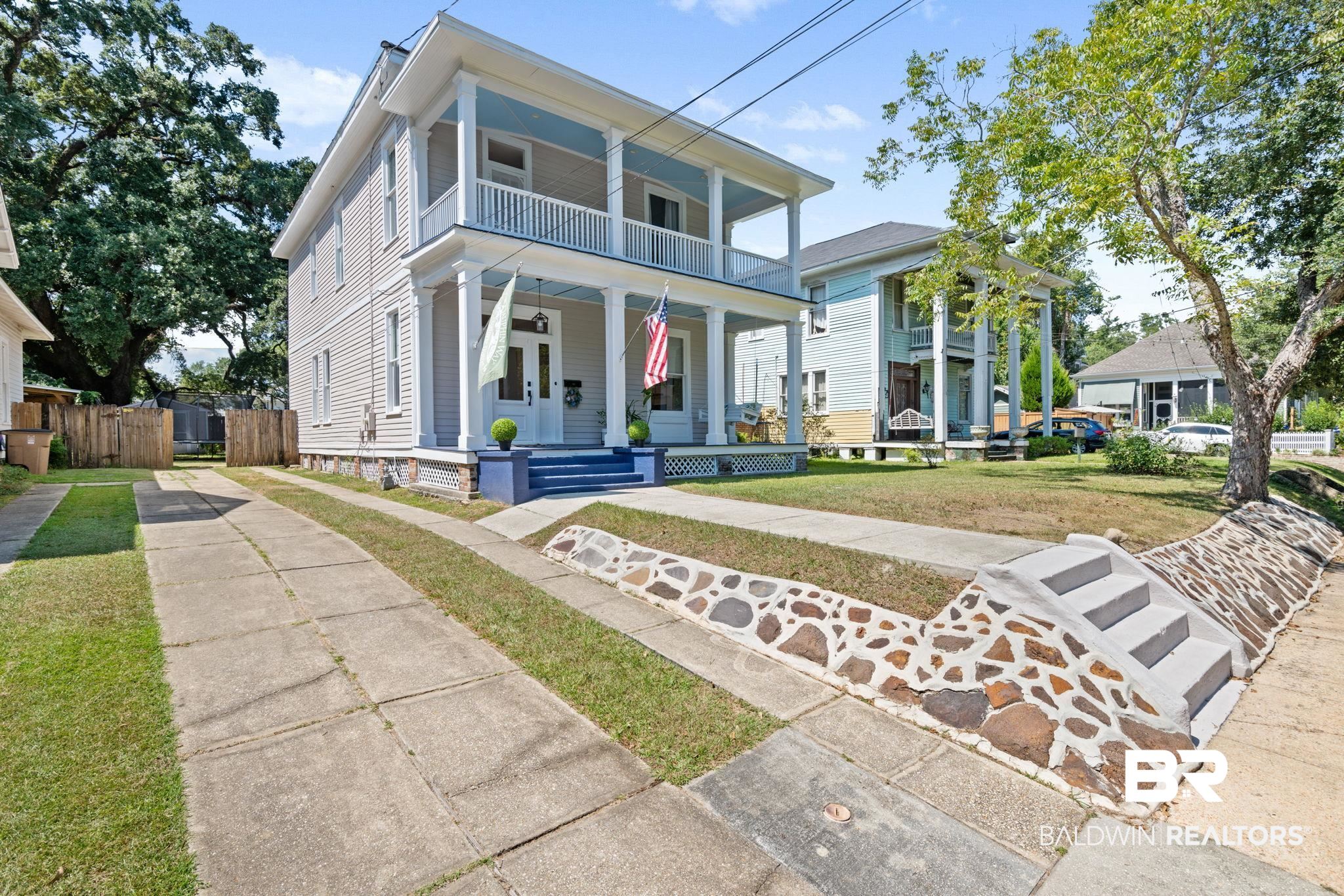 10 South Monterey Street Mobile, AL 36604 - Photo 3 of 45 View of front of house with covered porch, driveway, and a front yard