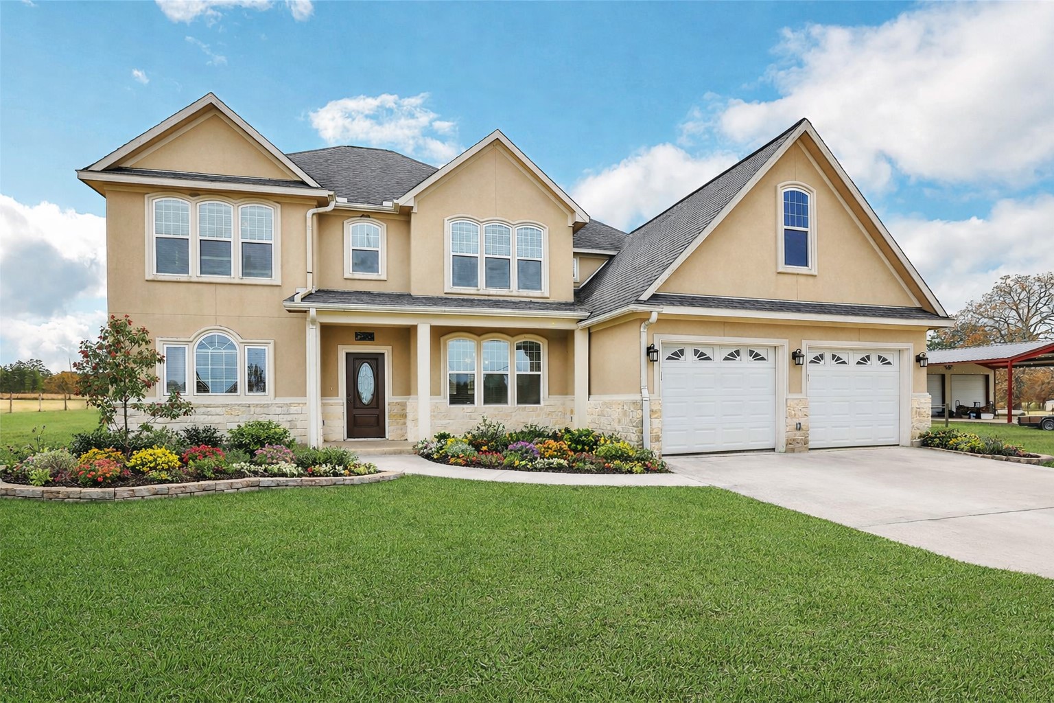 a front view of a house with a yard and porch