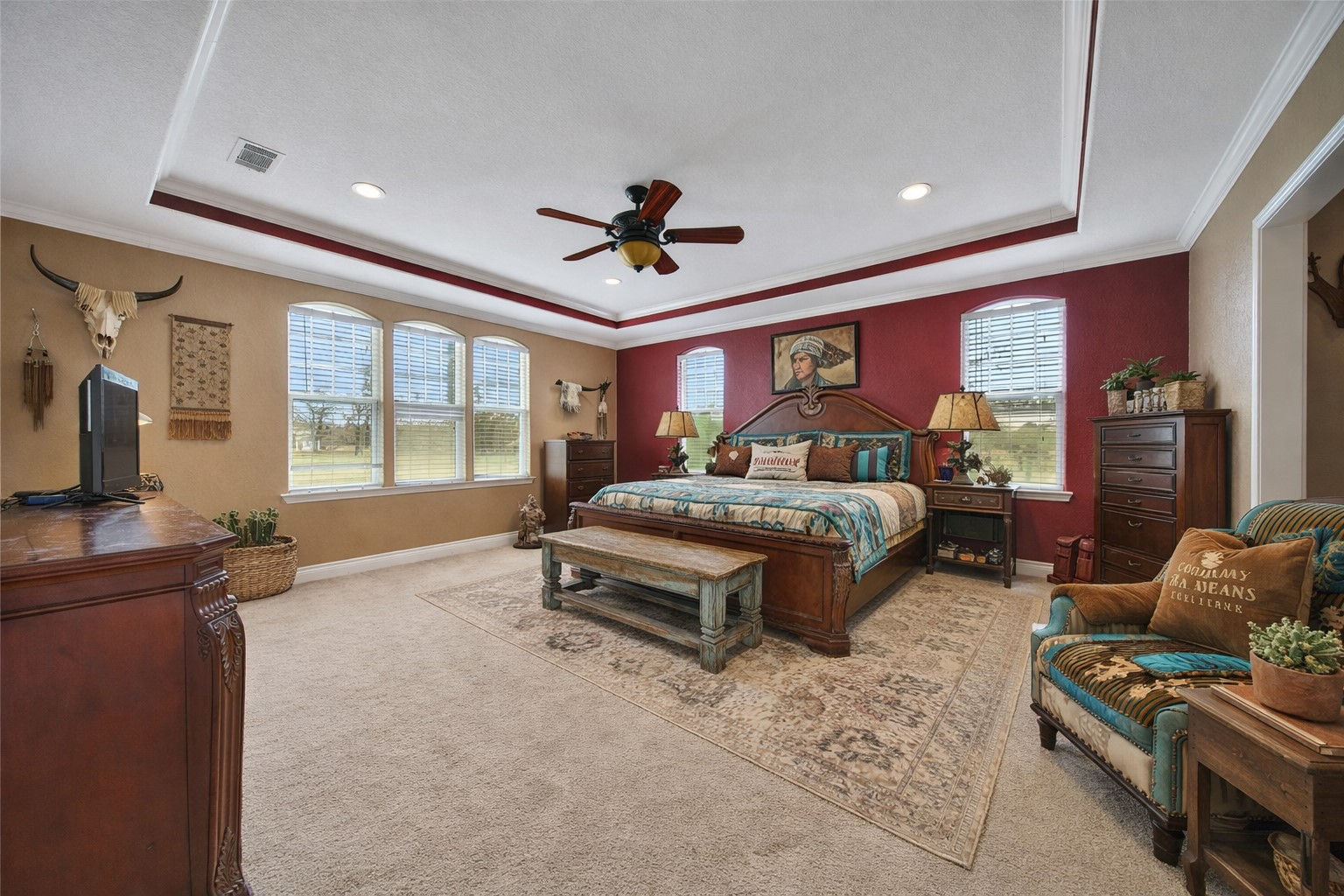 22 O'Bannon Ranch Road Huntsville, TX 77320 - Photo 14 of 31 a spacious bedroom with a bed and glass windows