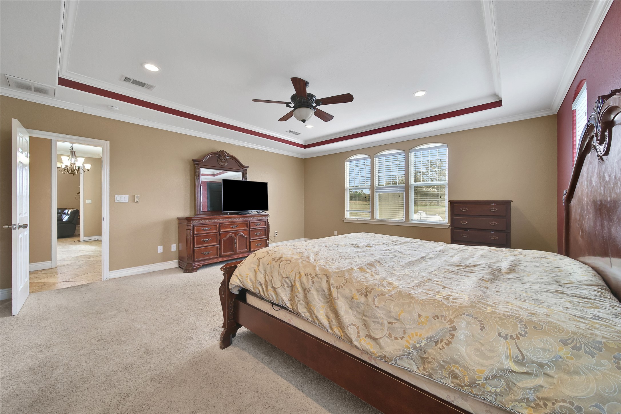 22 O'Bannon Ranch Road Huntsville, TX 77320 - Photo 16 of 31 a bedroom with a bed and a flat screen tv