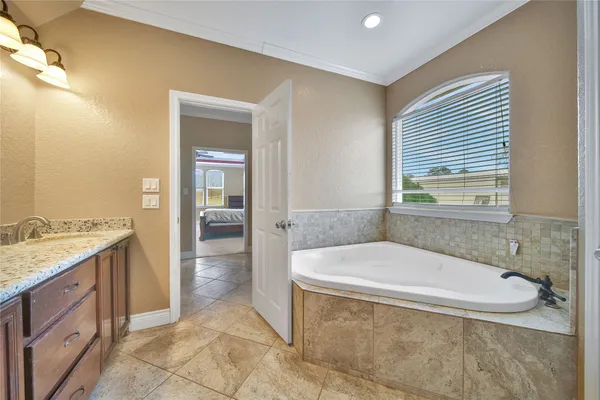 a bathroom with a sink a toilet and shower curtain