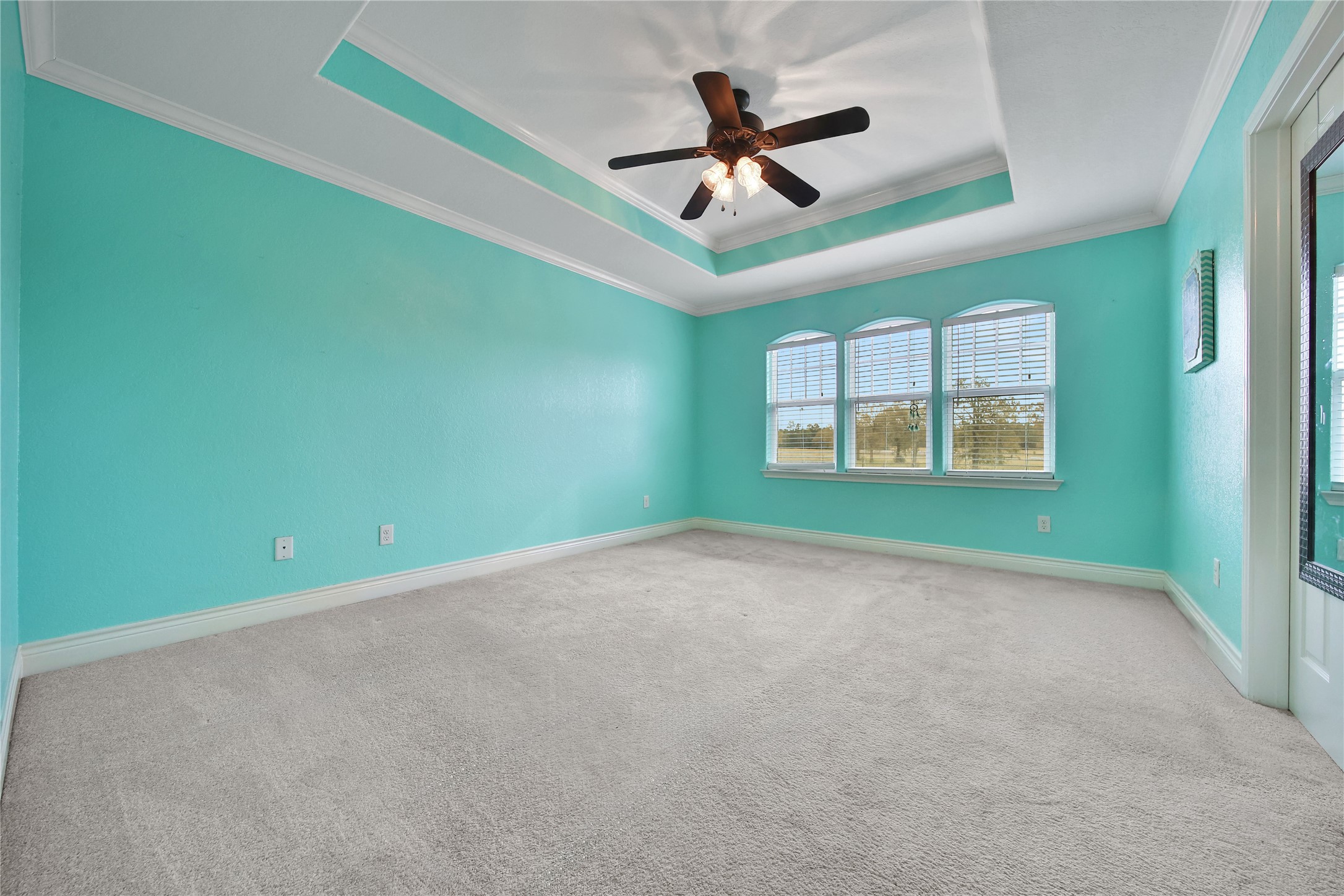 22 O'Bannon Ranch Road Huntsville, TX 77320 - Photo 25 of 31 a view of a livingroom with a ceiling fan and windows