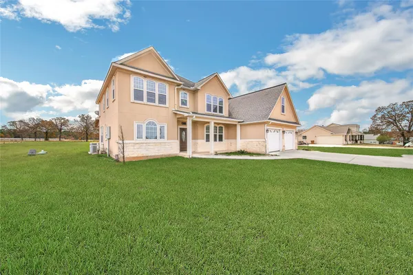 a view of an house with backyard porch and sitting area
