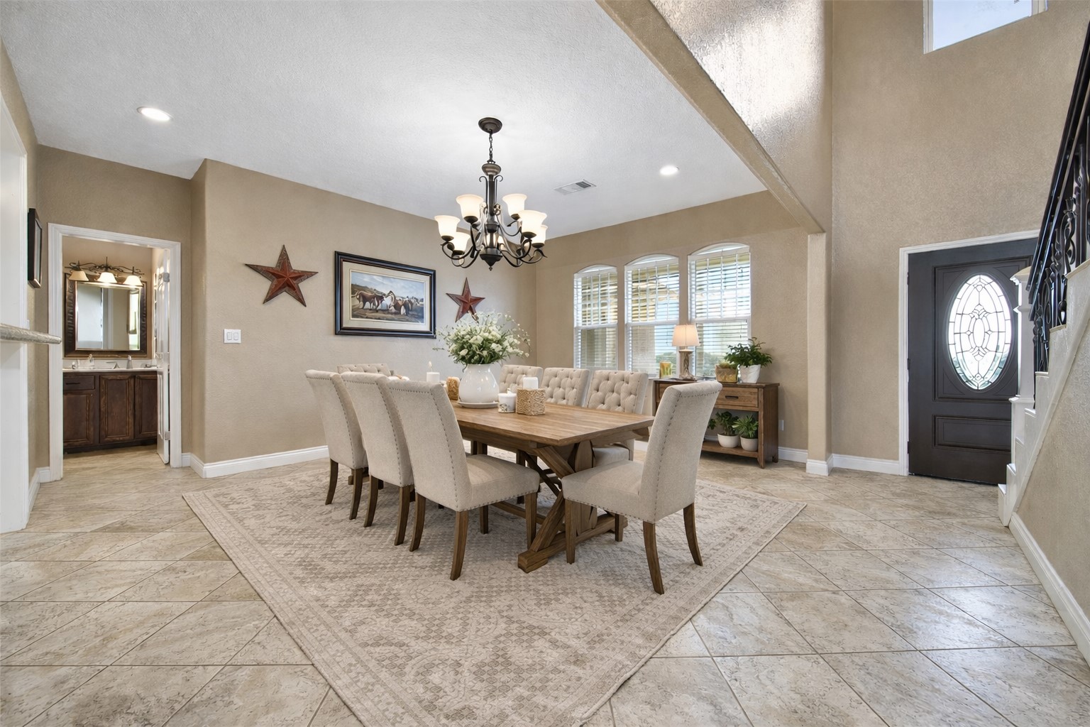 22 O'Bannon Ranch Road Huntsville, TX 77320 - Photo 5 of 31 a view of a dining room with furniture and a chandelier