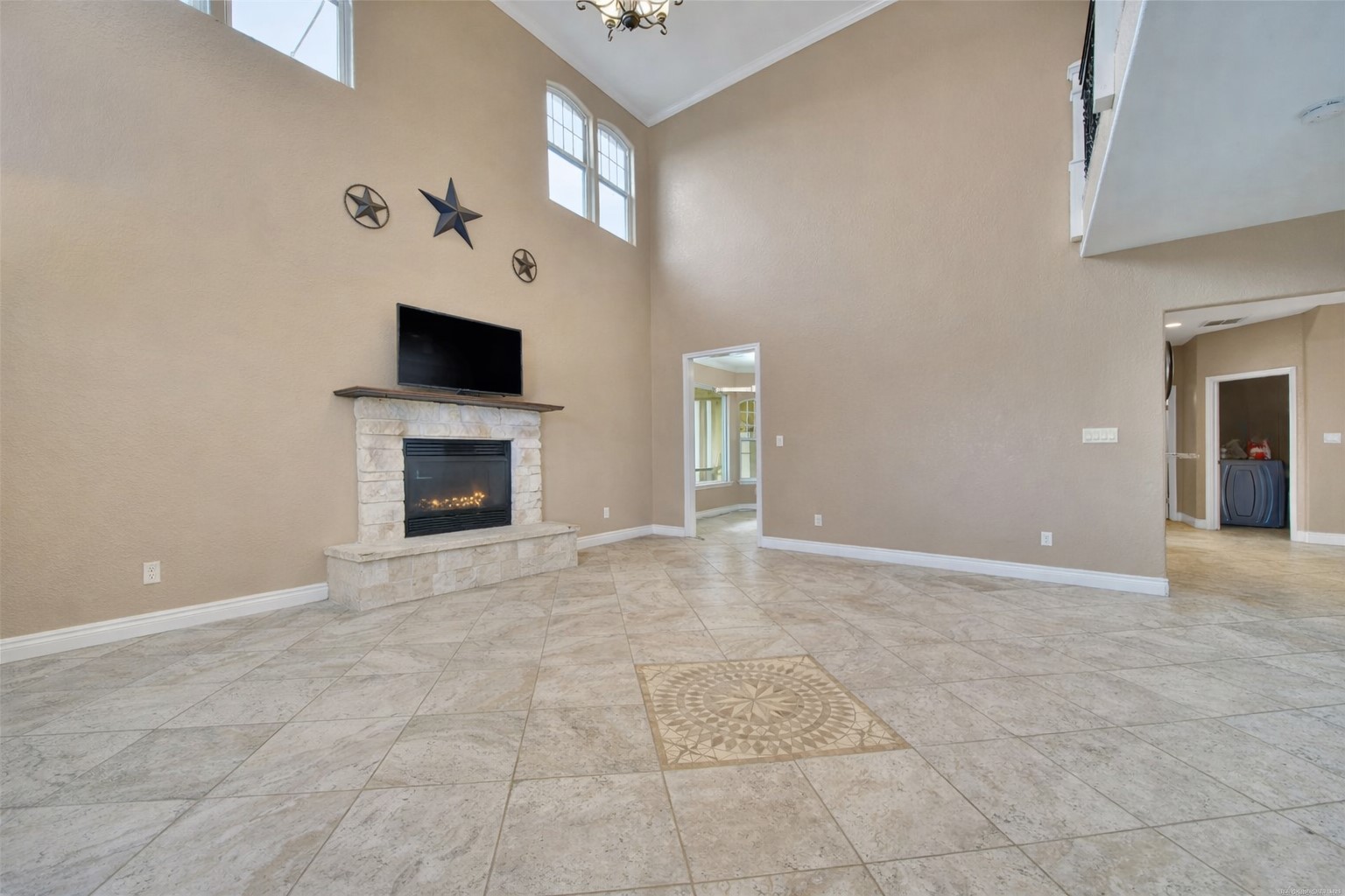 22 O'Bannon Ranch Road Huntsville, TX 77320 - Photo 7 of 31 a view of an empty room with a fireplace and a window