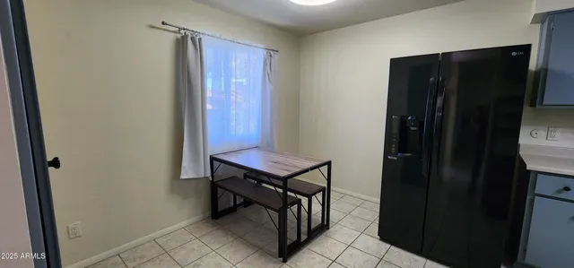 a view of a hallway with furniture