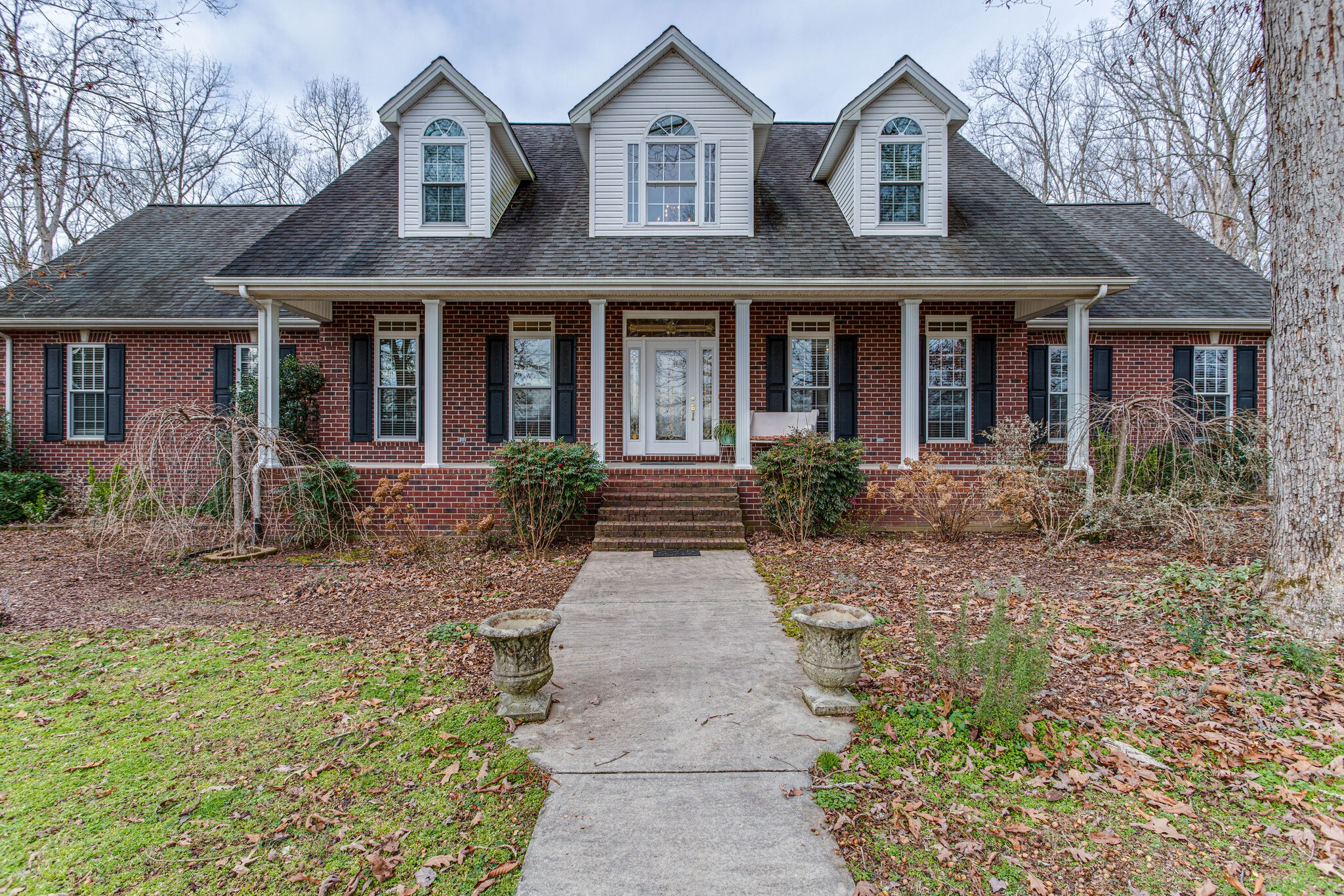 918 Urban Farms Road Manchester, TN 37355 - Photo 1 of 63 a front view of a house with garden