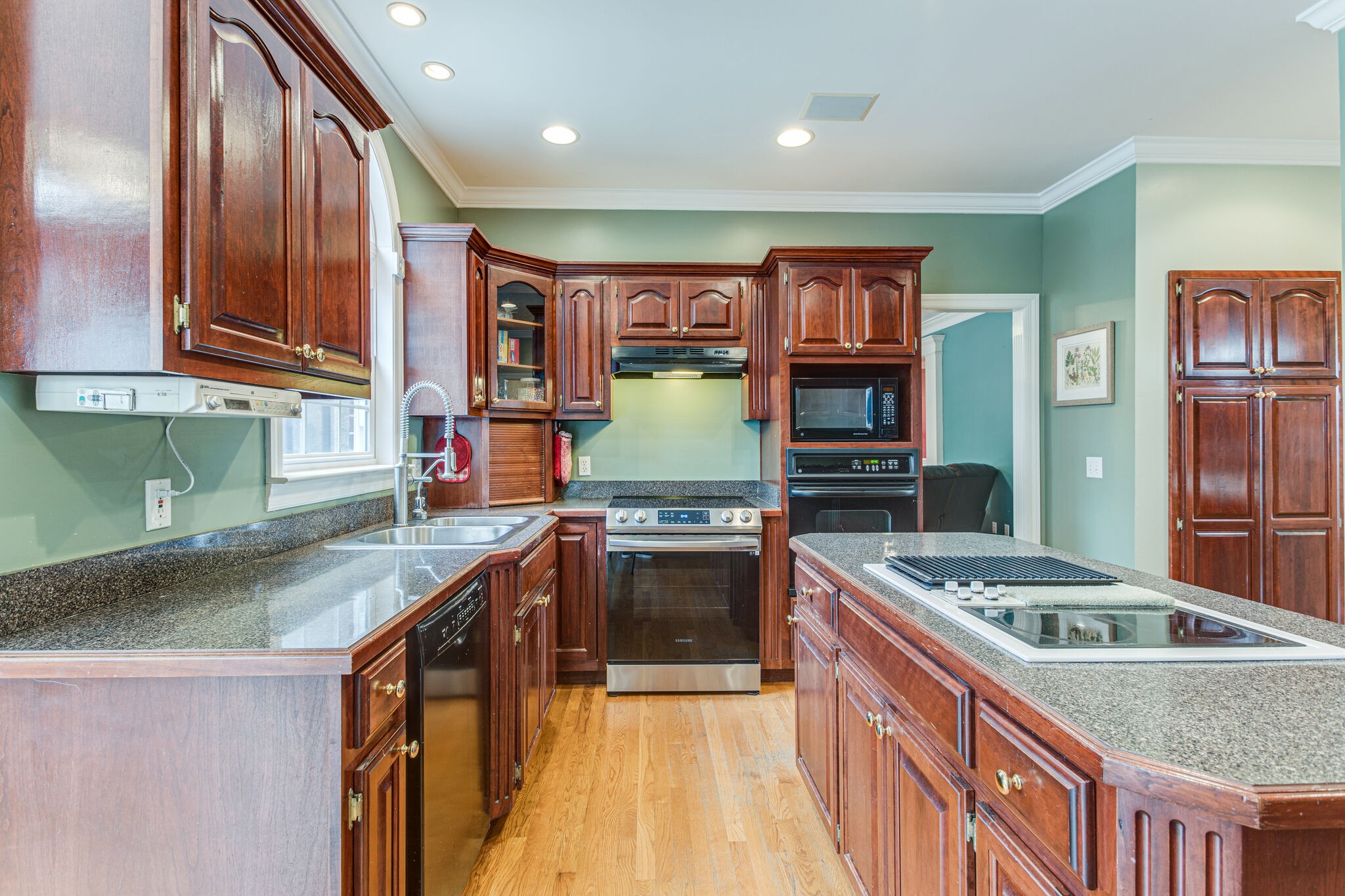 918 Urban Farms Road Manchester, TN 37355 - Photo 17 of 63 a kitchen with stainless steel appliances granite countertop a stove and a sink