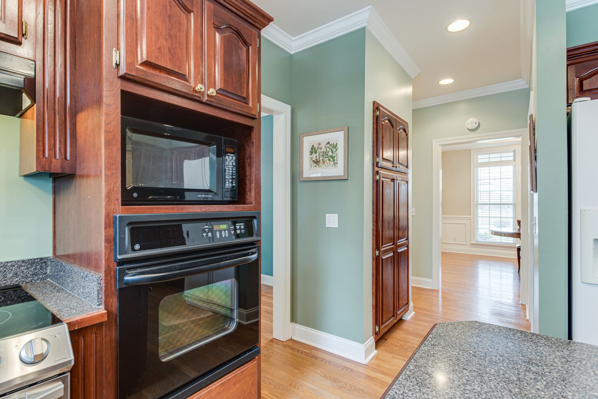 918 Urban Farms Road Manchester, TN 37355 - Photo 18 of 63 a kitchen with granite countertop a stove and a microwave oven