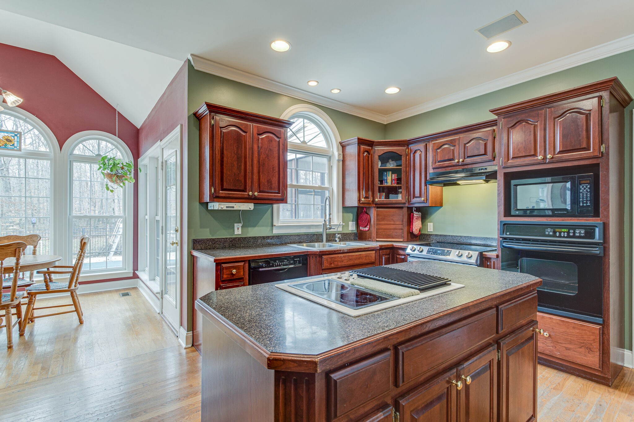918 Urban Farms Road Manchester, TN 37355 - Photo 19 of 63 a kitchen with a stove a sink a oven a dining table and chairs