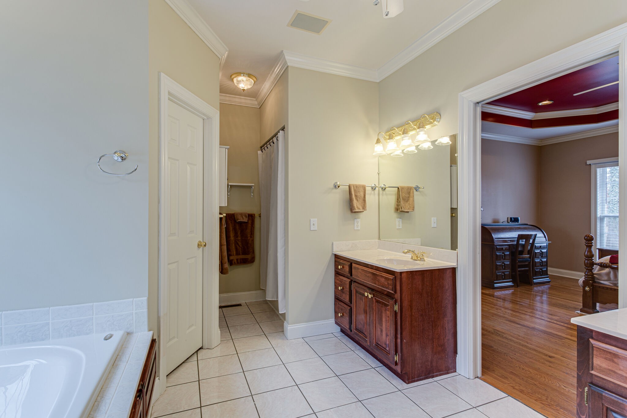 918 Urban Farms Road Manchester, TN 37355 - Photo 28 of 63 a bathroom with a sink a mirror and a shower