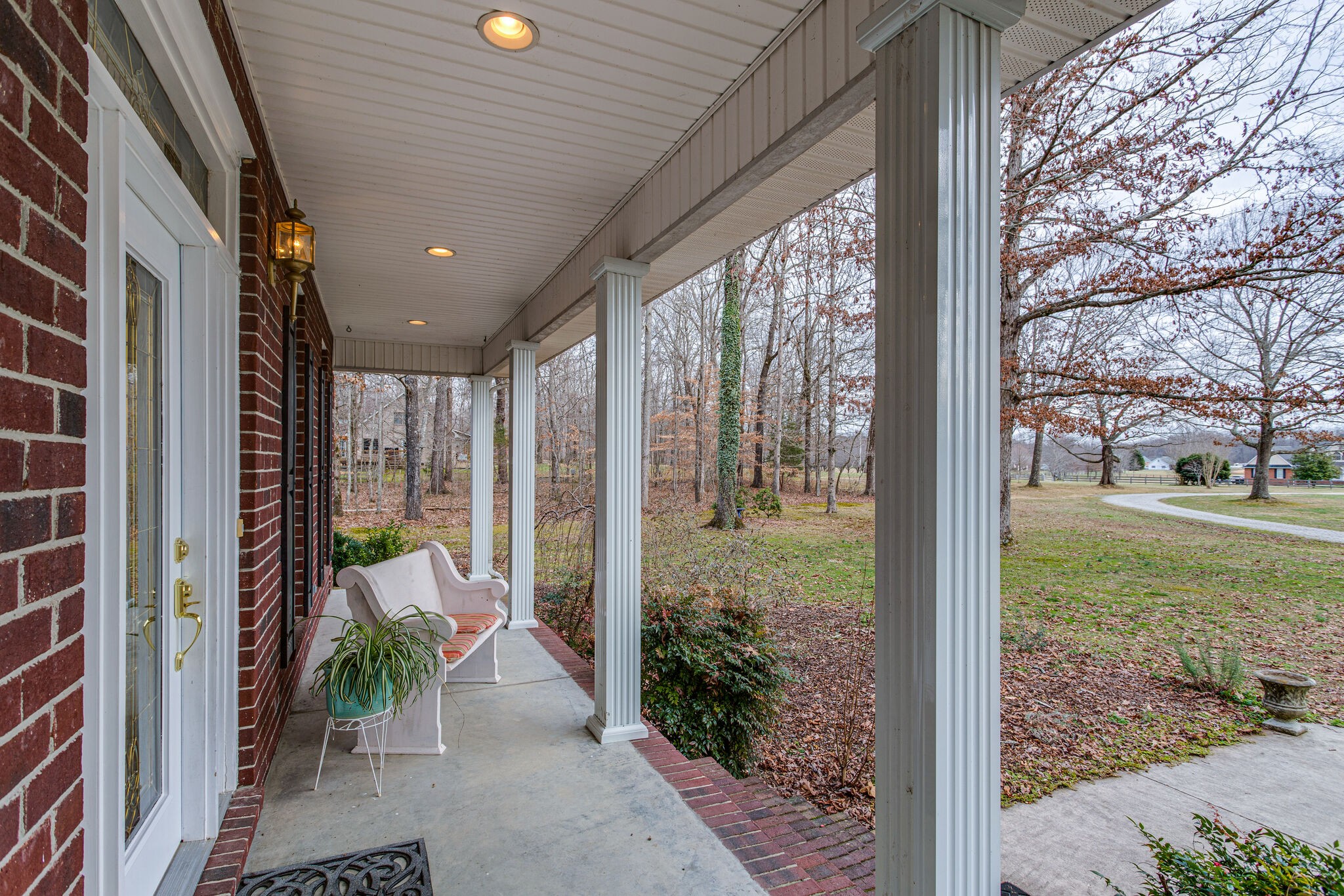 918 Urban Farms Road Manchester, TN 37355 - Photo 5 of 63 a view of a porch with chairs and potted plants