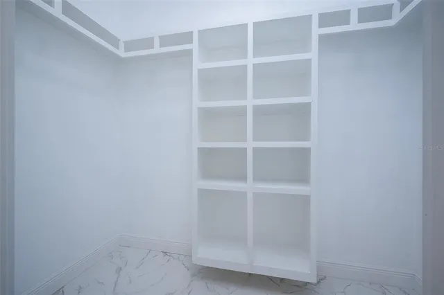 a view of an empty walk in closet