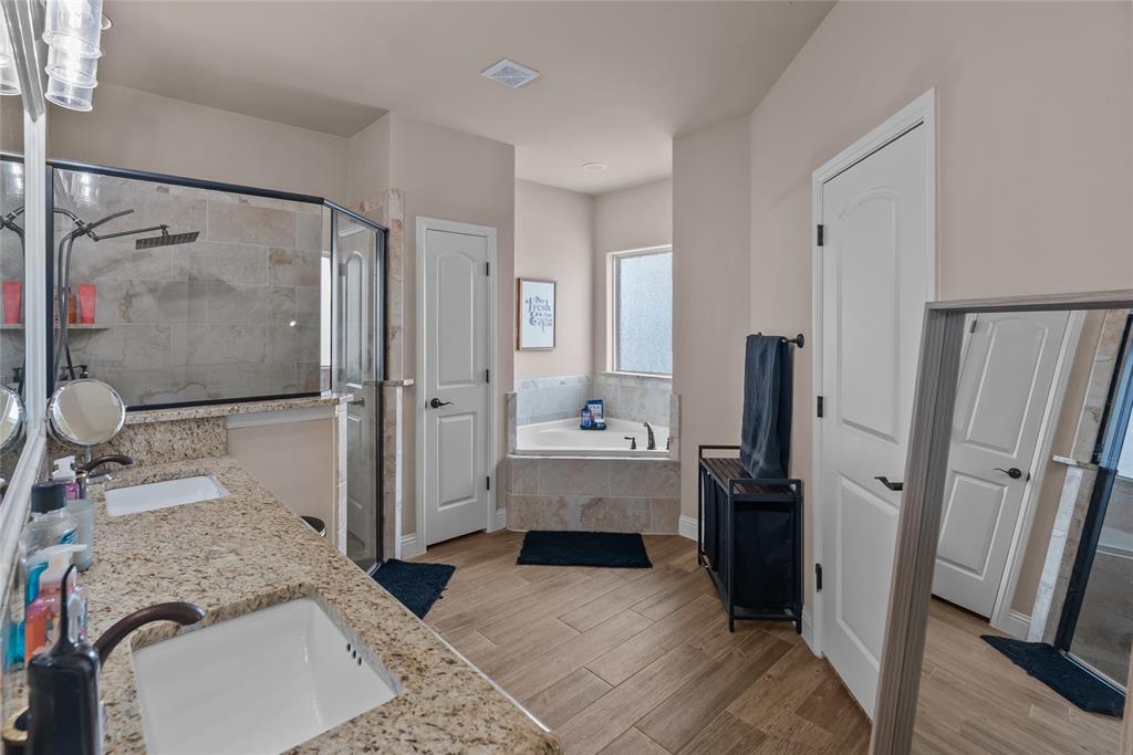 222 Rees Avenue Godley, TX 76044 - Photo 13 of 25 a bathroom with a tub sink and mirror