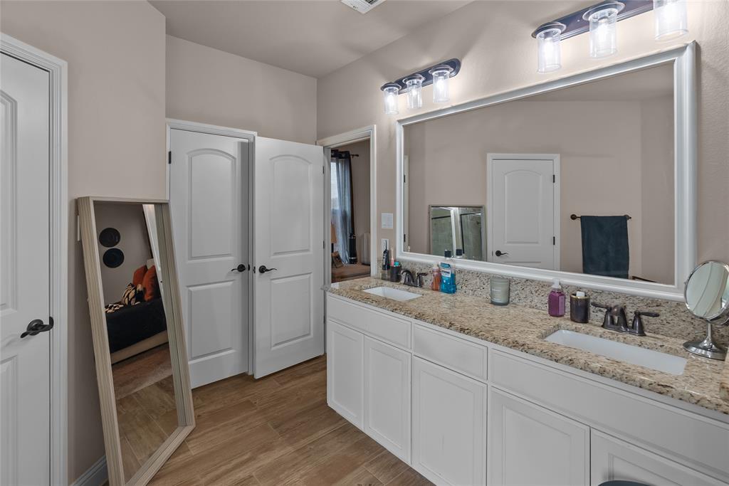 222 Rees Avenue Godley, TX 76044 - Photo 14 of 25 a bathroom with a double vanity sink and mirror