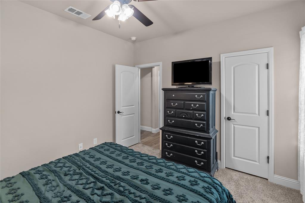 222 Rees Avenue Godley, TX 76044 - Photo 20 of 25 a bedroom with a bed and television