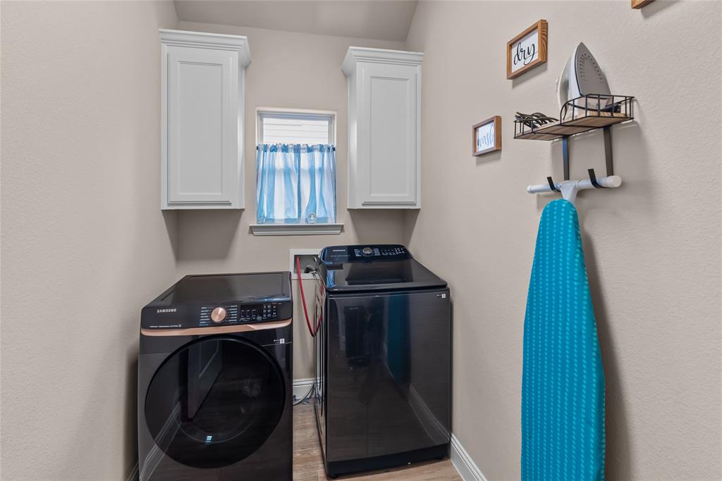 222 Rees Avenue Godley, TX 76044 - Photo 21 of 25 a utility room with dryer and washer