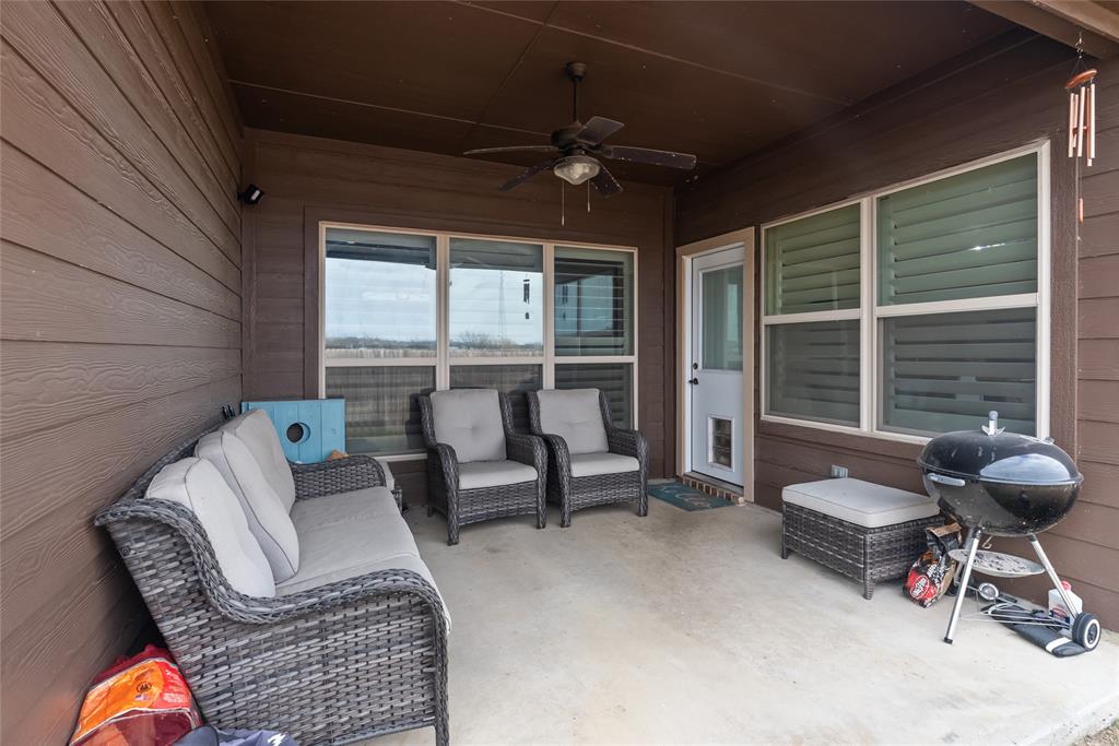 222 Rees Avenue Godley, TX 76044 - Photo 22 of 25 a living room with furniture and a large window