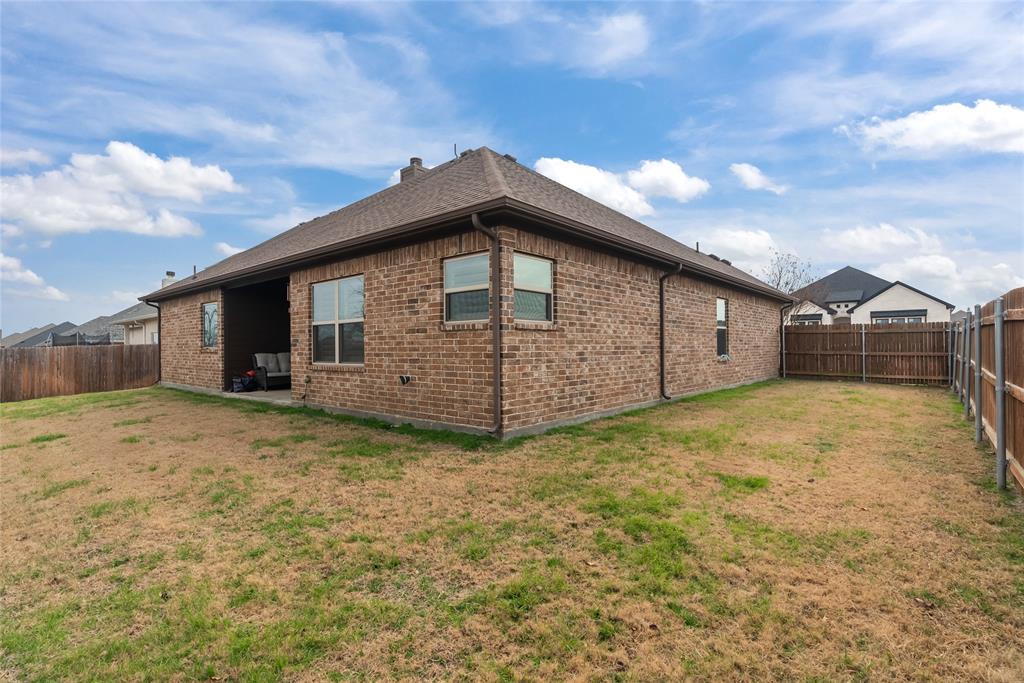 222 Rees Avenue Godley, TX 76044 - Photo 23 of 25 a view of a house with a yard