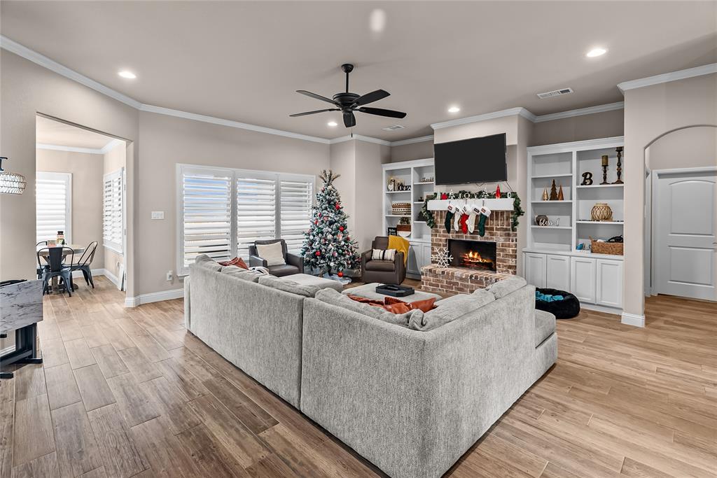 222 Rees Avenue Godley, TX 76044 - Photo 7 of 25 a living room with furniture and a wooden floor