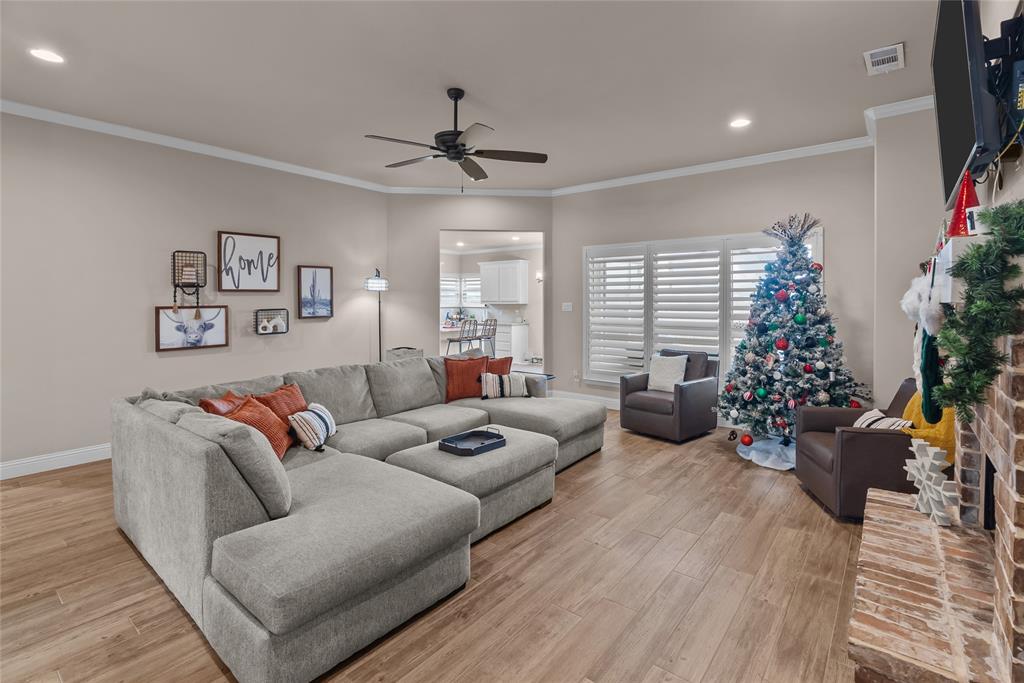 222 Rees Avenue Godley, TX 76044 - Photo 8 of 25 a living room with furniture potted plant and a window