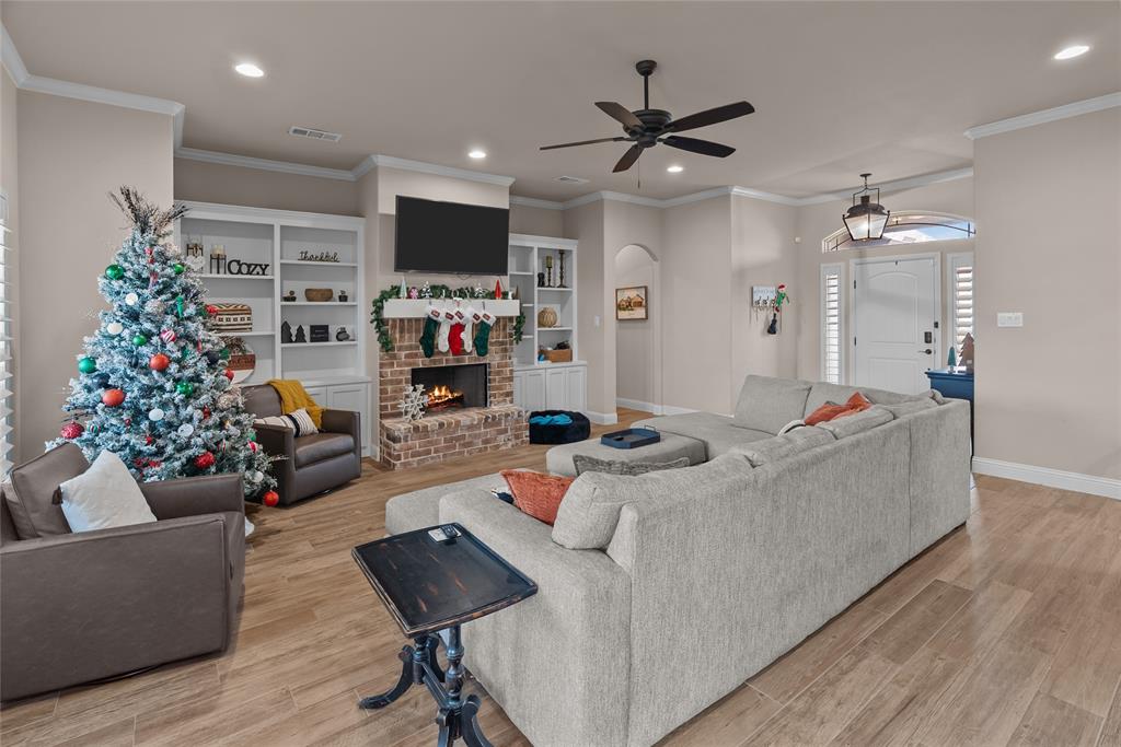 222 Rees Avenue Godley, TX 76044 - Photo 9 of 25 a living room with furniture and a flat screen tv