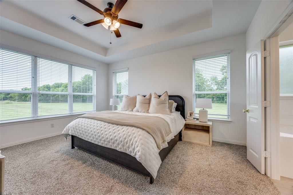 1933 Franklin Road Tom Bean, TX 75090 - Photo 16 of 28 a bed room with a bed and a window