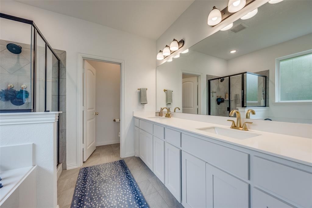 1933 Franklin Road Tom Bean, TX 75090 - Photo 19 of 28 a spacious bathroom with a double vanity sink shower and a mirror