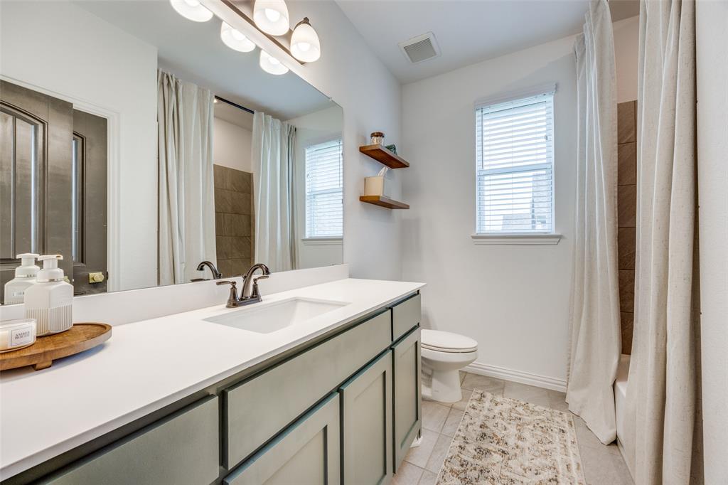 1933 Franklin Road Tom Bean, TX 75090 - Photo 25 of 28 a bathroom with a sink and a mirror
