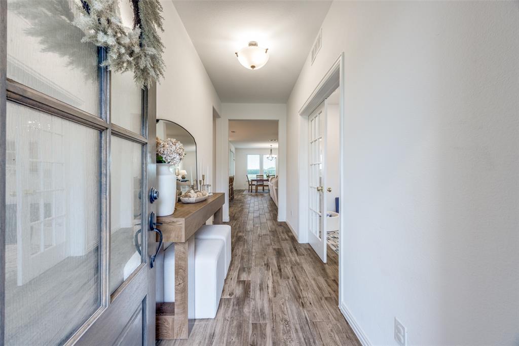 1933 Franklin Road Tom Bean, TX 75090 - Photo 5 of 28 a view of a hallway with wooden floor and staircase
