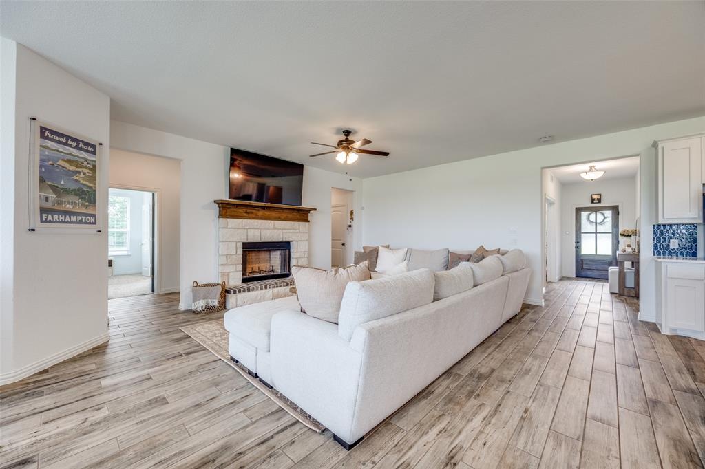 1933 Franklin Road Tom Bean, TX 75090 - Photo 6 of 28 a living room with furniture and a fireplace
