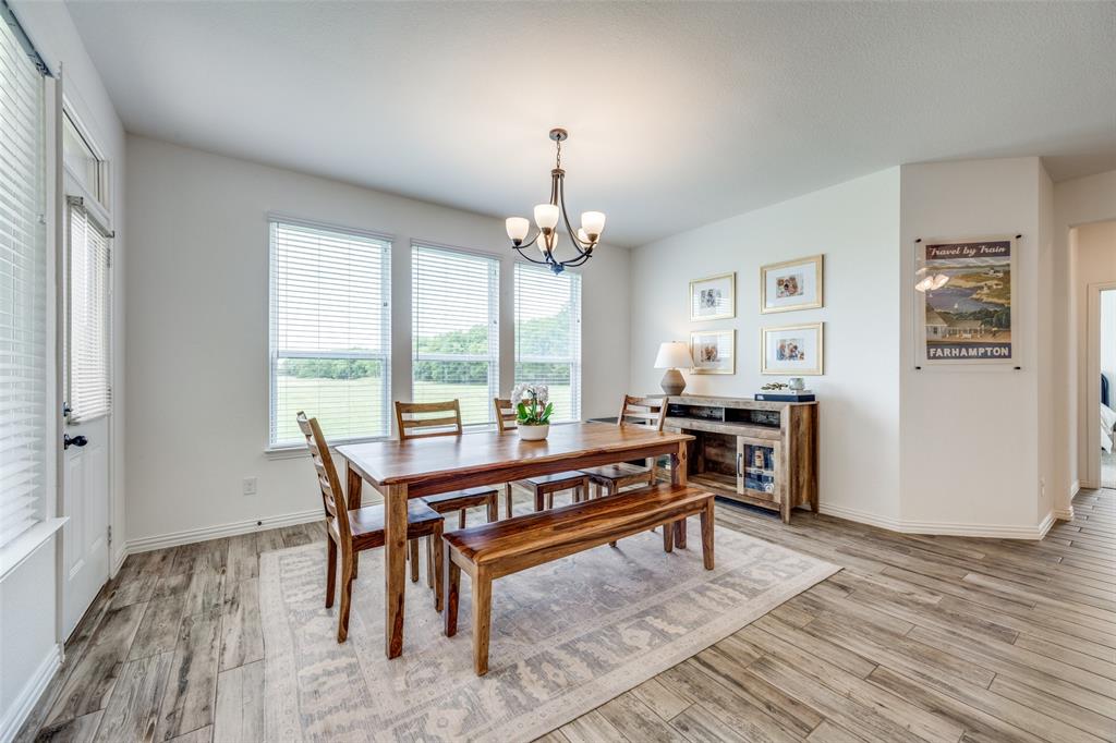 1933 Franklin Road Tom Bean, TX 75090 - Photo 8 of 28 a view of a dining room with furniture window and wooden floor