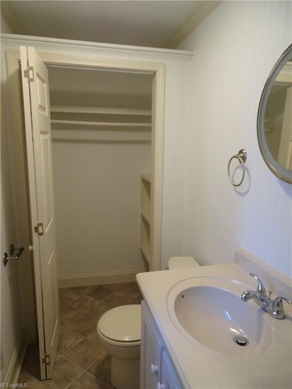 119 Ridgewood Drive Lexington, NC 27292 - Photo 18 of 31 half bath, this use to be a full bath and seller took out the tub due to low water pressure in this bath and just added a closet.