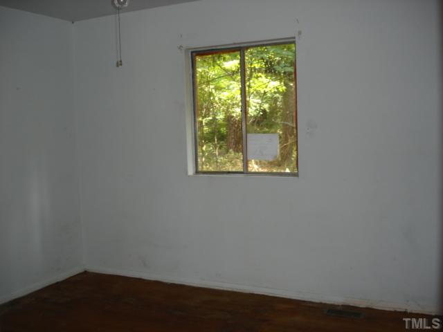 1415 Kelly Road Garner, NC 27529 - Photo 8 of 10 a view of a small space with wooden floor and a window