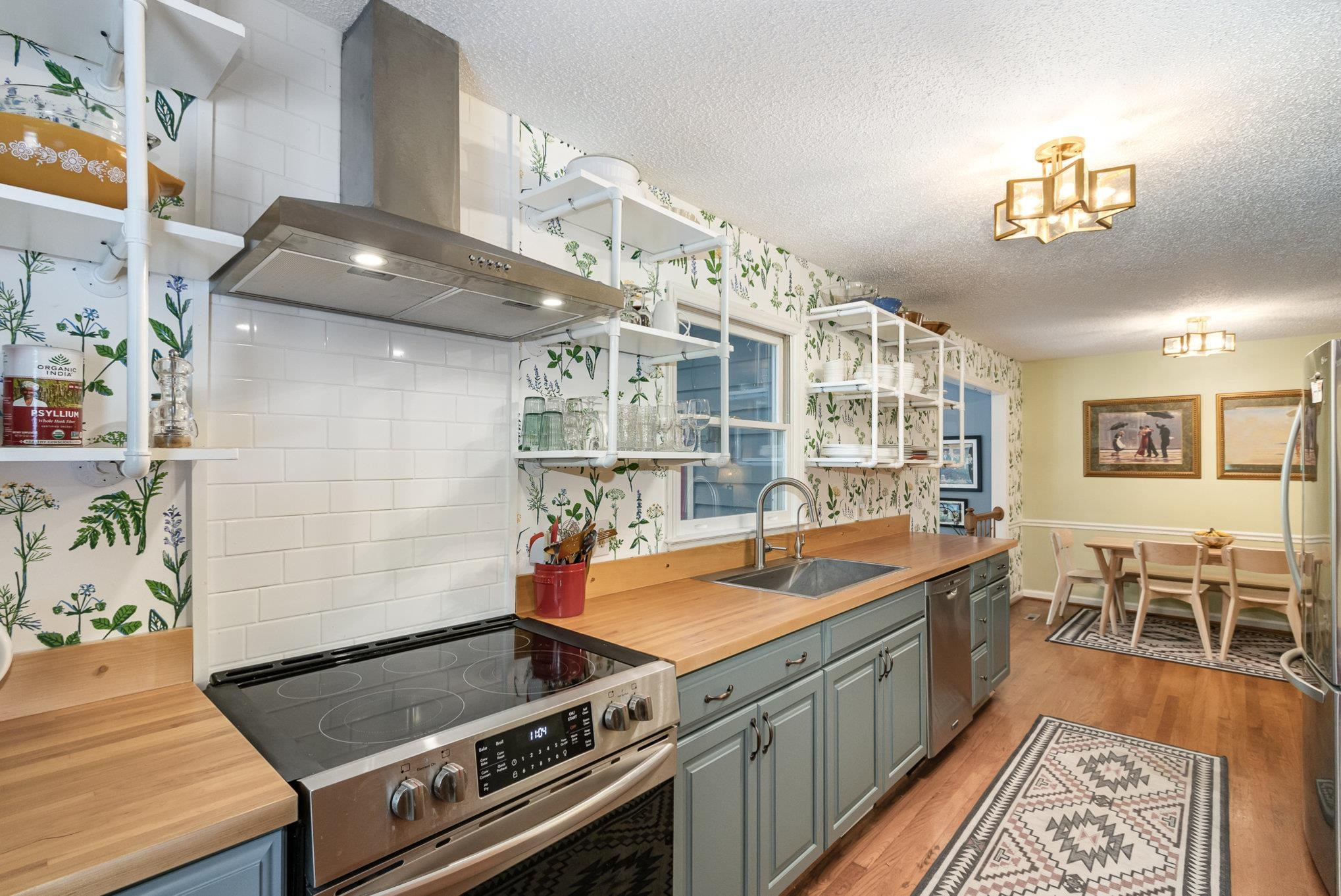 3200 Twin Streams Road Chapel Hill, NC 27516 - Photo 11 of 46 a kitchen with a stove and a table