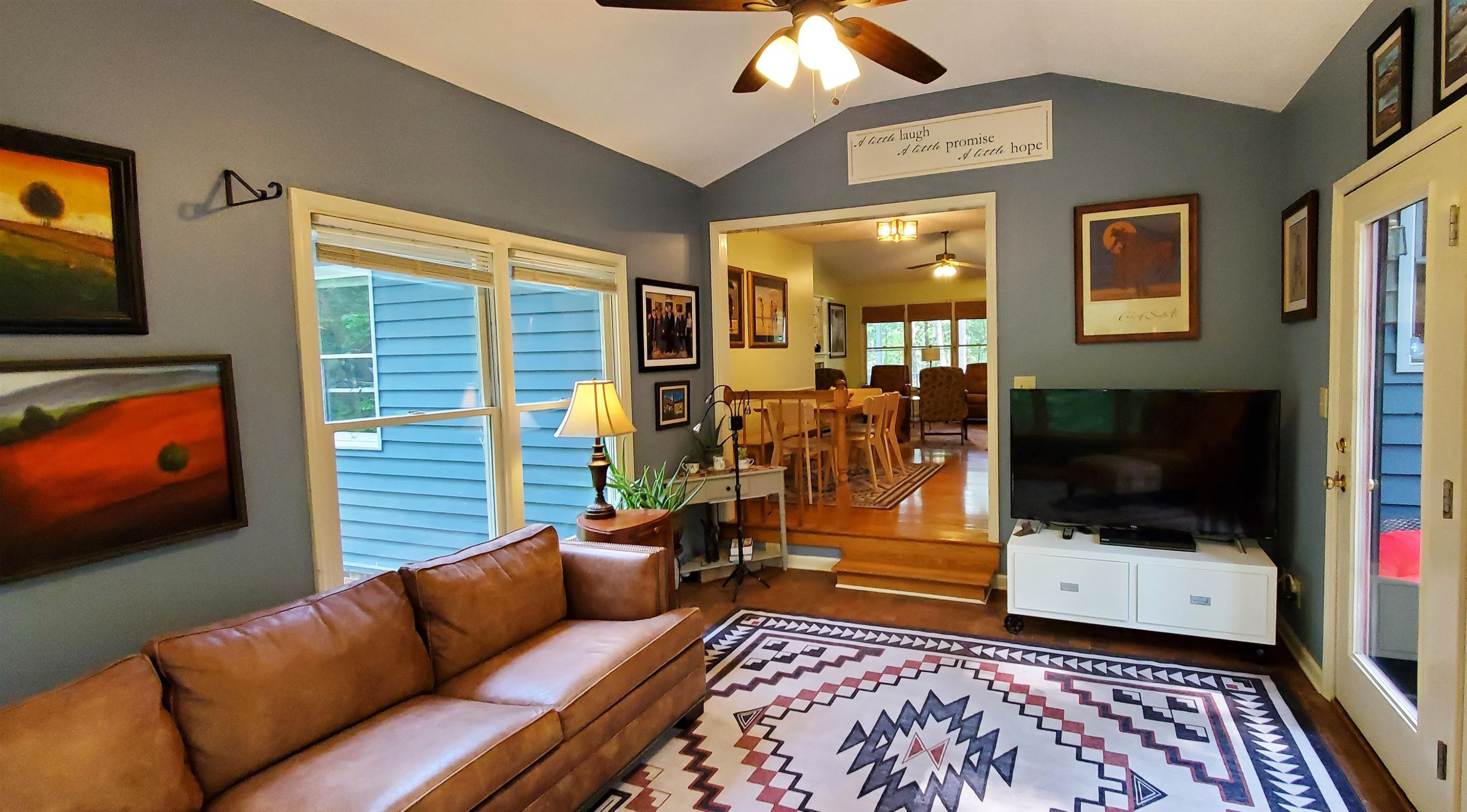 3200 Twin Streams Road Chapel Hill, NC 27516 - Photo 17 of 46 a living room with furniture and a flat screen tv