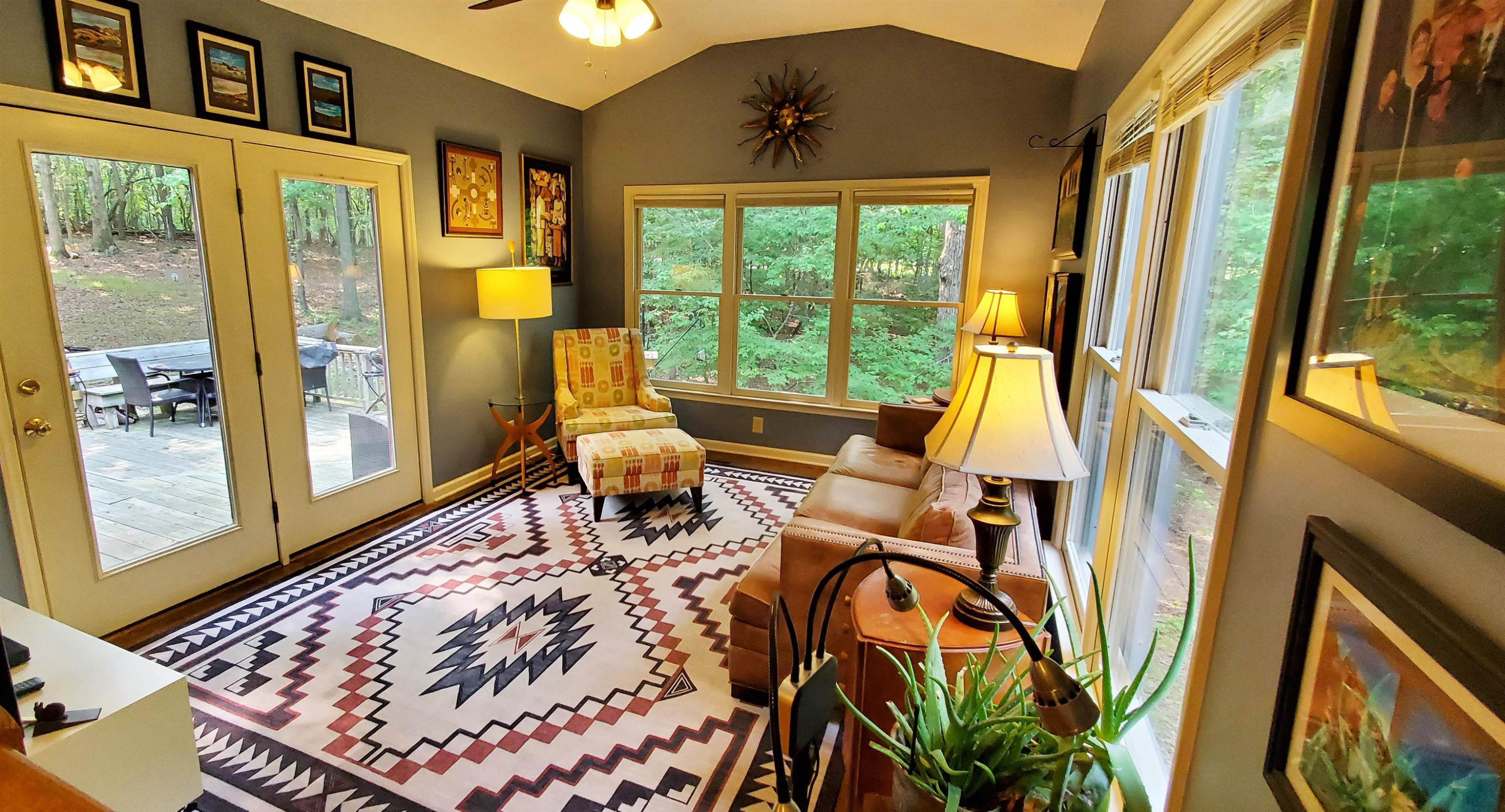 3200 Twin Streams Road Chapel Hill, NC 27516 - Photo 18 of 46 a living room with furniture and a floor to ceiling window